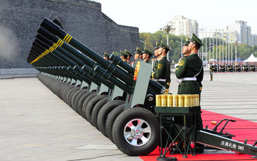 Sixty-gun salutes, flag raising ceremony kick off grand celebration