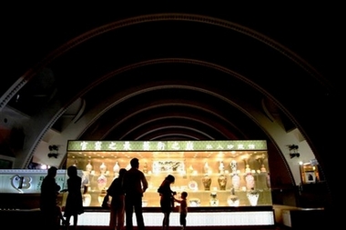 Guests view a display of Chinese antiques at the Millionaire Fair Shanghai 2007 on Saturday June 2, 2007 in Shanghai, China. The fair, which runs from 1-3 June, is a festival of super-luxury goods for Chinese consumers. (AP