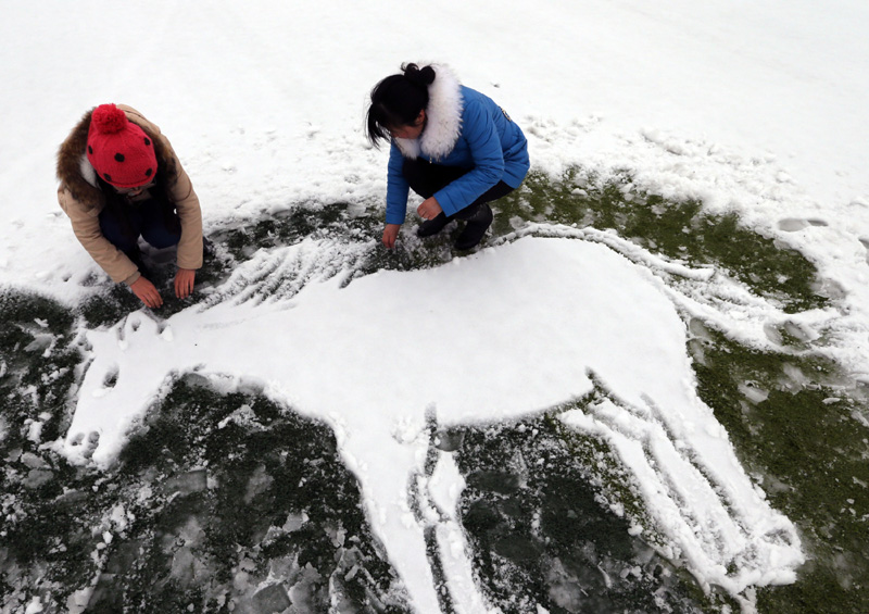 Spring snow blankets northern and eastern China