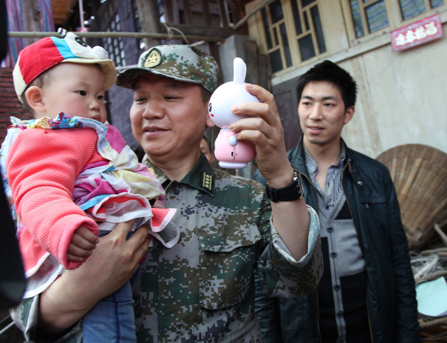 Rescuers celebrate first birthday of 'quake babies'