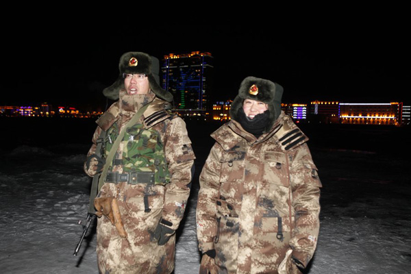 Couple sentries guard China's northern border during traditional holiday