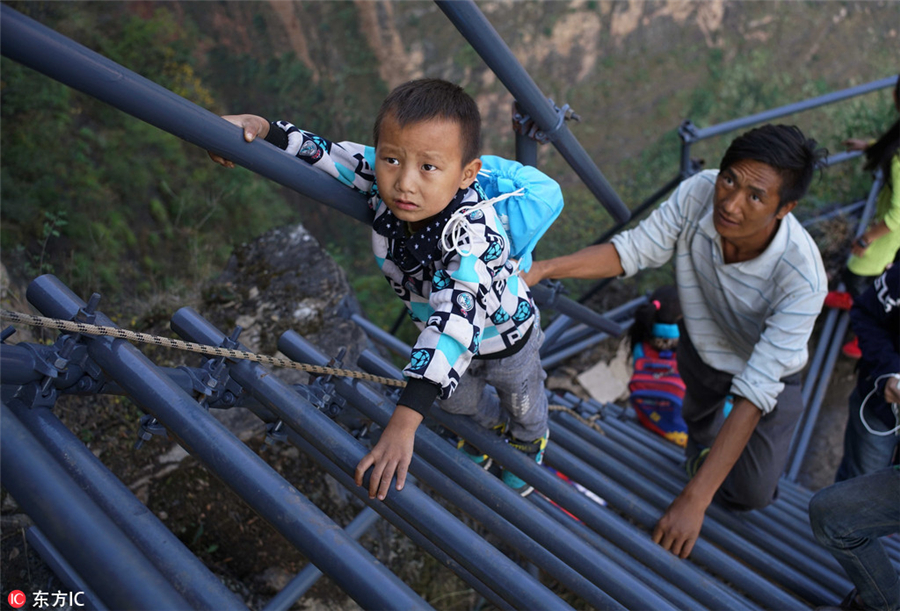 Steel ladder opens safer path for cliff village children