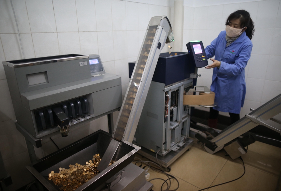 Cramped fingers, 24-hour security and sticky tape all part of a money counter's job