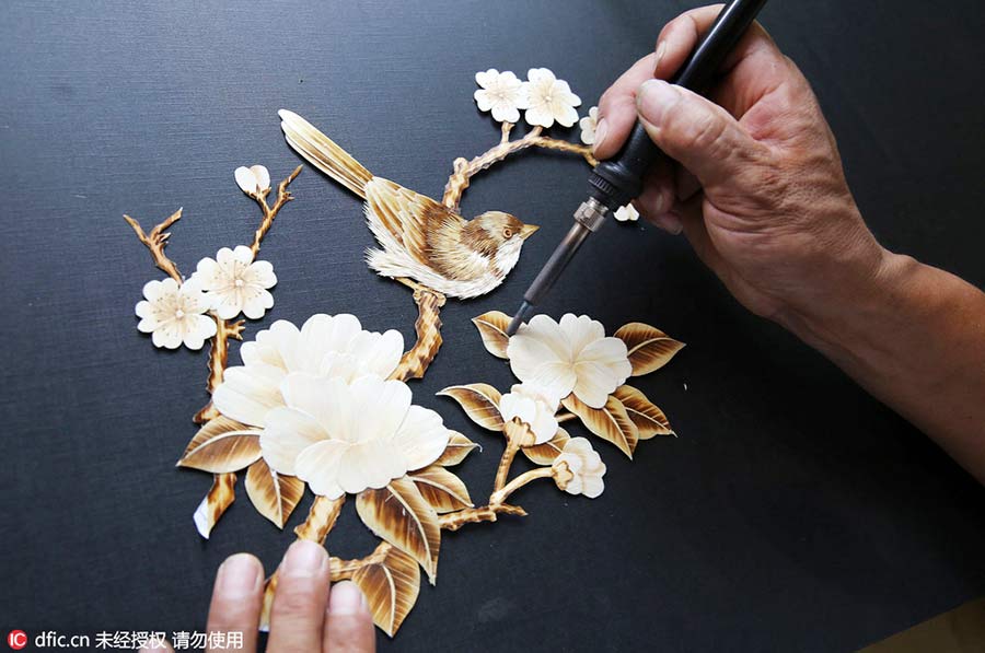 Turning straw to gold: folk artist's straw pyrography