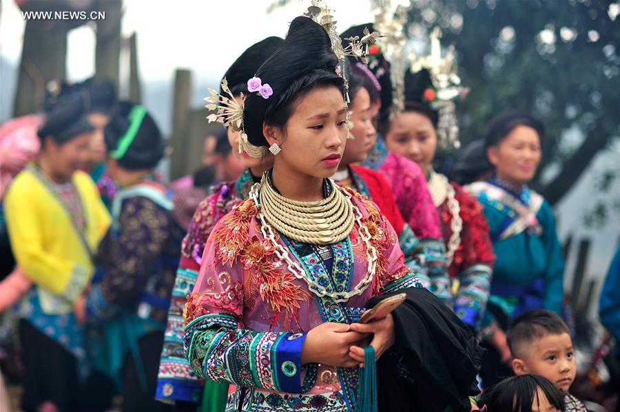 Miao women dress up to celebrate Spring Festival