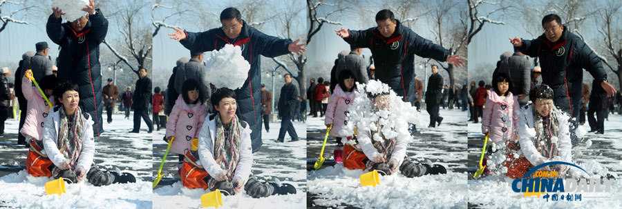 北京春分迎強(qiáng)降雪 頤和園游人“雪戰(zhàn)”