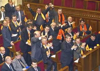 Ukrainian lawmakers react as they declare the disputed presidential election to be invalid in Kiev, Saturday, Nov. 27, 2004. Ukraine's parliament on Saturday declared invalid the disputed presidential election that led to a week of growing street protests. The legislators' move was not legally binding, but was a clear demonstration of rising dissatisfaction. The parliament also passed a vote of no-confidence in the Central Elections Commission, which like the other vote is not legally binding. (AP 