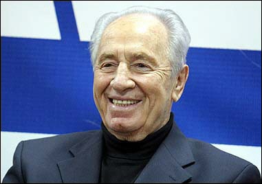 Former Israeli prime minister Shimon Peres smiles during a meeting with students at the headquarters of his Labour party in Tel Aviv. Peres will serve as Israeli Prime Minister Ariel Sharon's number two in a new coalition government. [AFP]