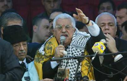 Palestinian presidential candidate Mahmoud Abbas speaks to his supporters at a campaign rally at the Khan Younis refugee camp southern Gaza Strip (news - web sites), January 4, 2005. Moderate Palestinian leader Mahmoud Abbas called Israel 'the Zionist enemy' for the first time on Tuesday after an Israeli tank killed seven Palestinian youths in a Gaza strawberry field. (Suhaib Salem/Reuters) 