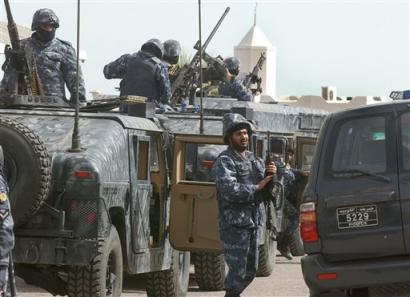 Kuwait State Security policemen arrive at the scene of a gun battle in Kuwait City on Sunday, Jan 30, 2005. [AP]