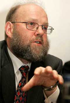 Professor Ian Wilmut speaks during a news conference in Edinburgh, February 8, 2005. Wilmut, the scientist who created Dolly the sheep, the world's first cloned mammal, was granted a license Tuesday to clone human embryos for medical research. Wilmut plans to obtain stem cells for research into Motor Neurone Disease(MND), a procedure that divides the medical world along ethical lines.