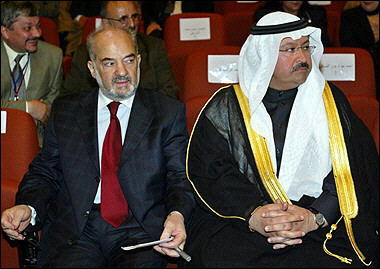 Incoming Iraqi prime minister Ibrahim Jaafari (L) sits with vice president Ghazi al-Yawer as Kurdish leader Jalal Talabani is sworn in as Iraq's president during a meeting of the National Assembly in Baghdad.(AFP/Ahmad al-Rubaye) 