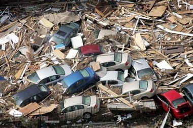 Cars are piled up among debris from Hurricane Katrina Wednesday, Aug. 31, 2005 in Gulfport, Miss. (AP