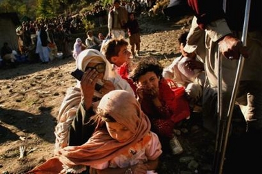 Villagers wait to be evacuated in an Army helicopter from Kaghan Valley, Pakistan, Thursday Oct. 27, 2005.