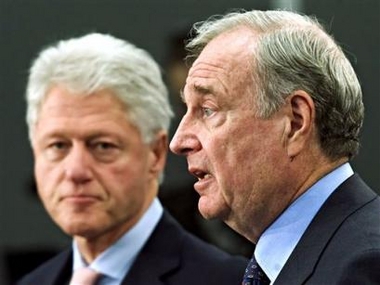 Former U.S. President Bill Clinton listens to Prime Minister Paul Martin respond to a question during a news conference at the United Nations Climate Change Conference in Montreal, Friday Dec. 9, 2005. 