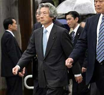 Japanese Prime Minister Junichiro Koizumi arrives at the Yasukuni Shrine in Tokyo Monday, Oct. 17, 2005.