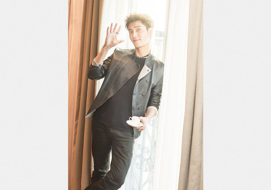 Chen Kun poses at Milan Fashion Week