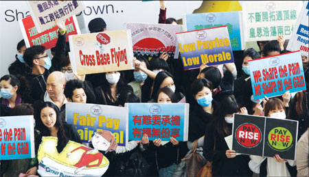 Cathay flight attendants threaten holiday action