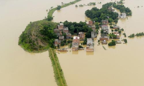 Floods breach dyke in river as rain persists