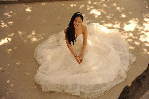 Graduates in wedding gowns honor college years