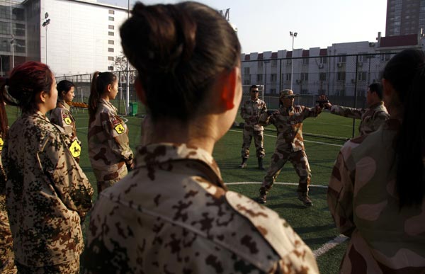 Female bodyguards keep threats at arm's length