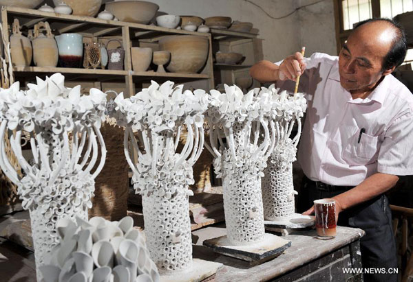 Ceramic artist and his porcelain works