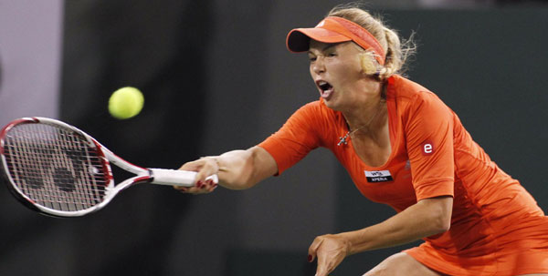 Wozniacki exits, Azarenka and Sharapova advance