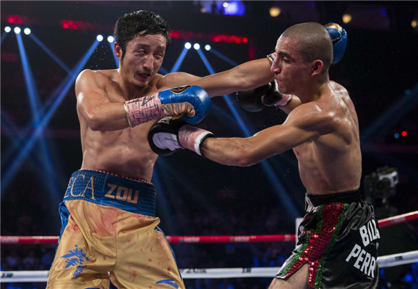 China's Zou Shiming wins third pro bout