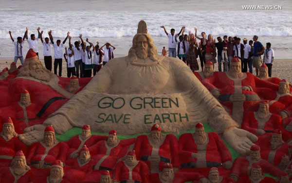 Artists create sand sculptures on beach of Puri, India