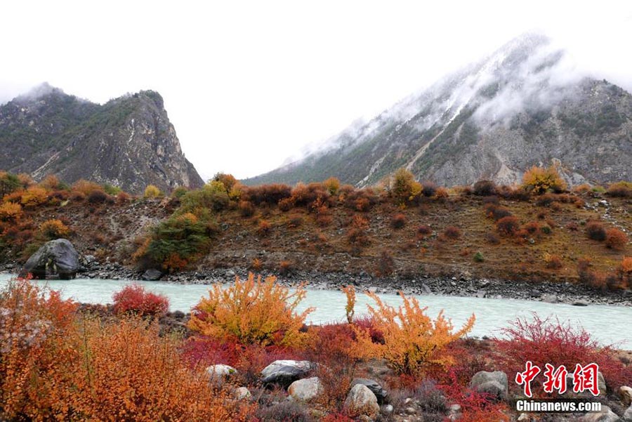 Snowy mountains and emerald lakes in Tibet