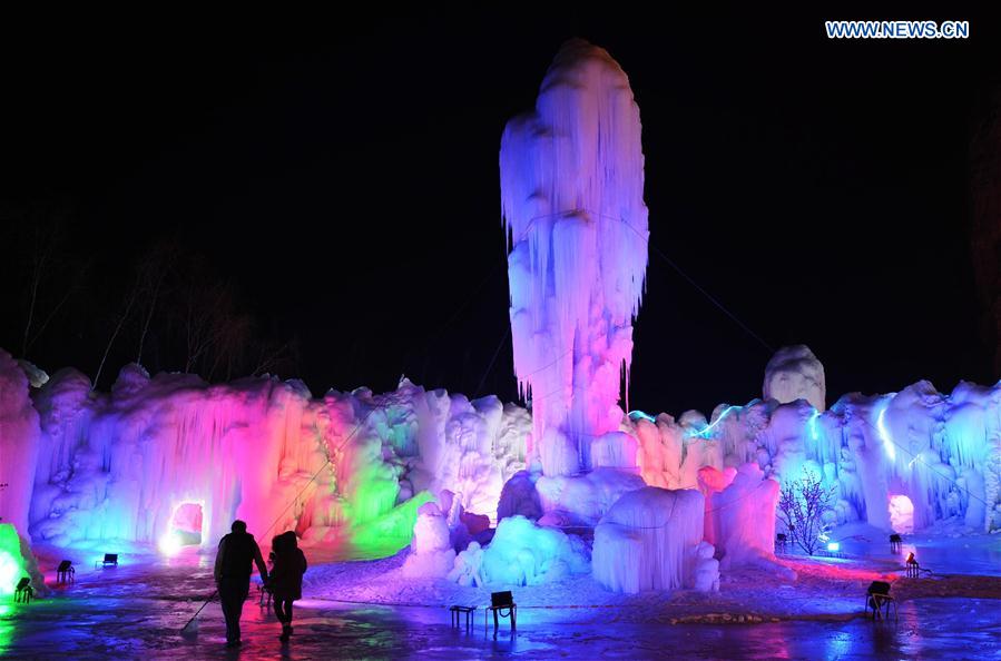 People visit frozen waterfall in N China