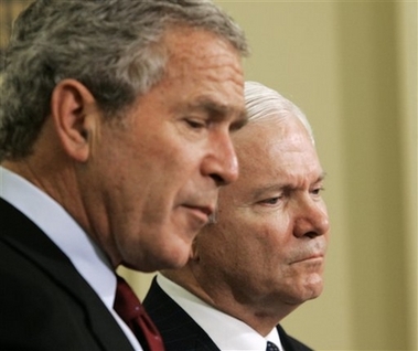 President Bush, left, accompanied by his Defense Secretary-nominee Robert Gates, makes the announcement in the Oval Office of the White House in Washington, Wednesday, Nov. 8, 2006. (AP