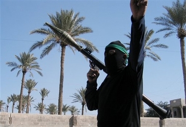 An armed militiaman holds a rocket propelled grenade launcher in Ramadi, Iraq, Tuesday, Dec. 5, 2006. Ramadi, 70 miles west of Baghdad, is located in Anbar province, where many Sunni-Arab insurgent groups are based. It has been the scene of some of the fiercest fighting between U.S. forces and insurgents. (AP