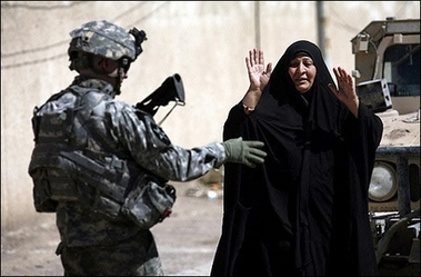 An Iraqi woman gestures as a US soldier from Baker Company 2-12 Infantry Battalion directs her toward his commander during a foot patrol through the streets of the predominantly Sunni al-Dora neighbourhood of southern Baghdad. US Secretary of Defense Robert Gates said Sunday it was too soon to know whether the US troop 