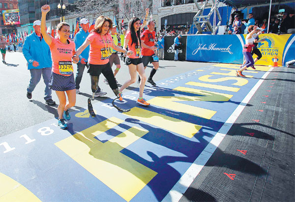 Runners rejoice in return to tightly policed Boston