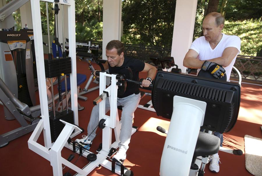 Russia's Putin works out in gym with Medvedev